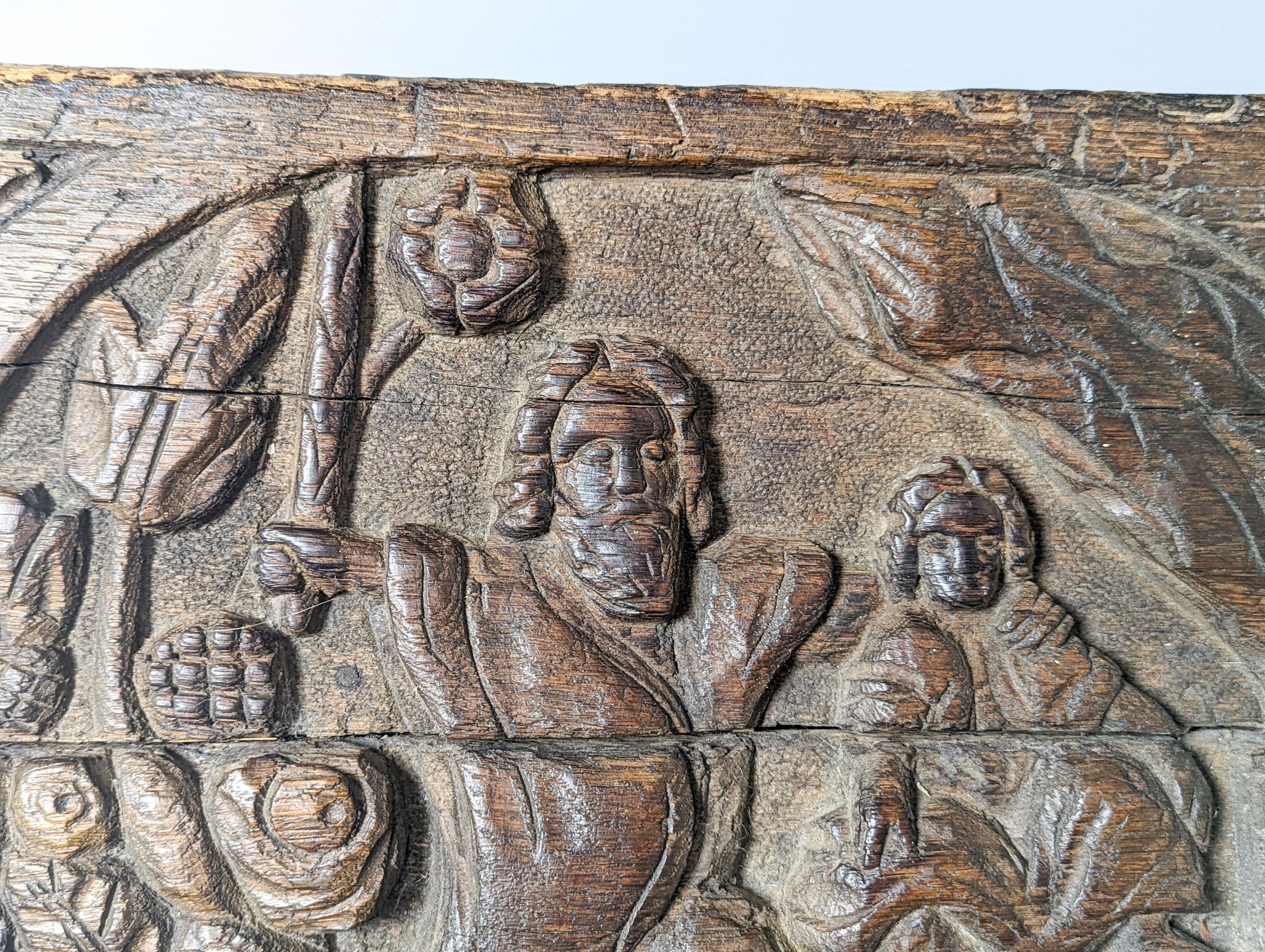 A 17th century style sunken-carved oak panel 37x61cm